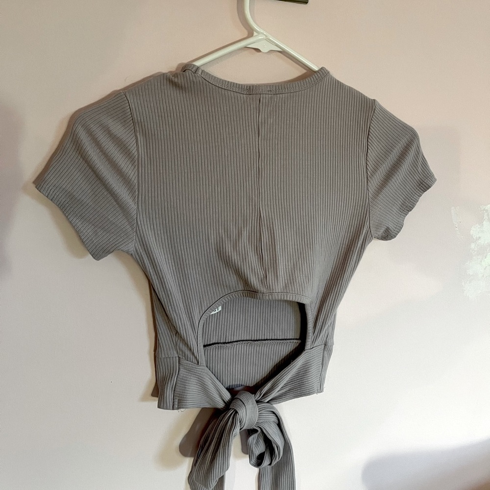 Garage purple tight fitting crop top with an open back and a tie